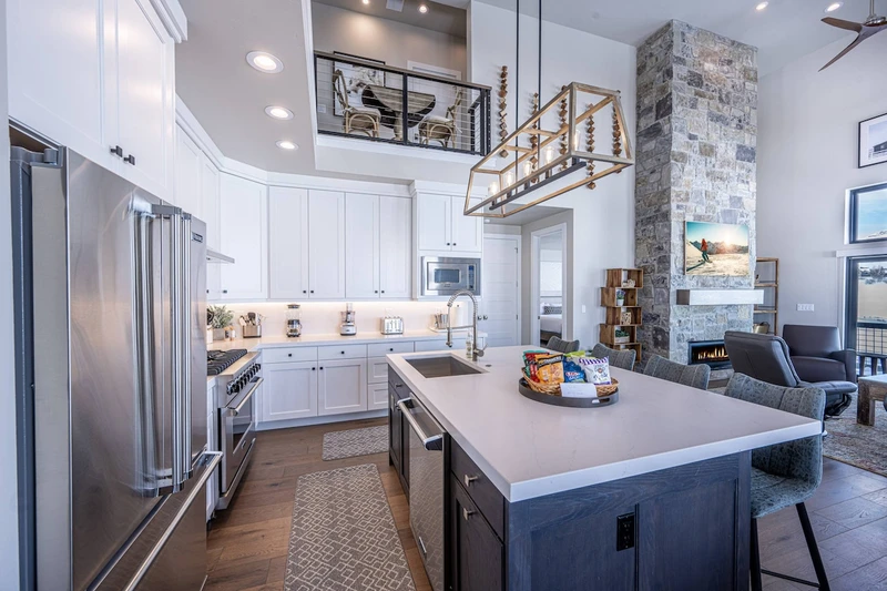 The kitchen outfitted with premium Viking appliances and expansive quartz countertops.