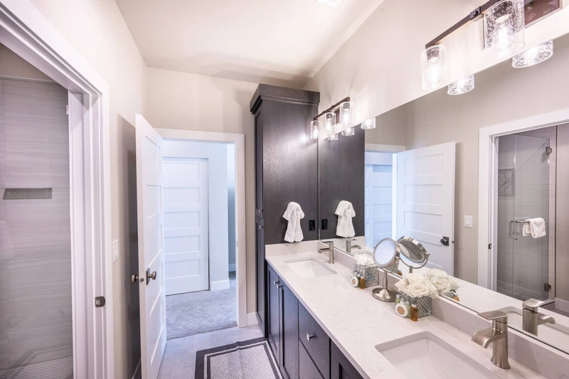 Dual vanity with lots of storage in the guest bathroom