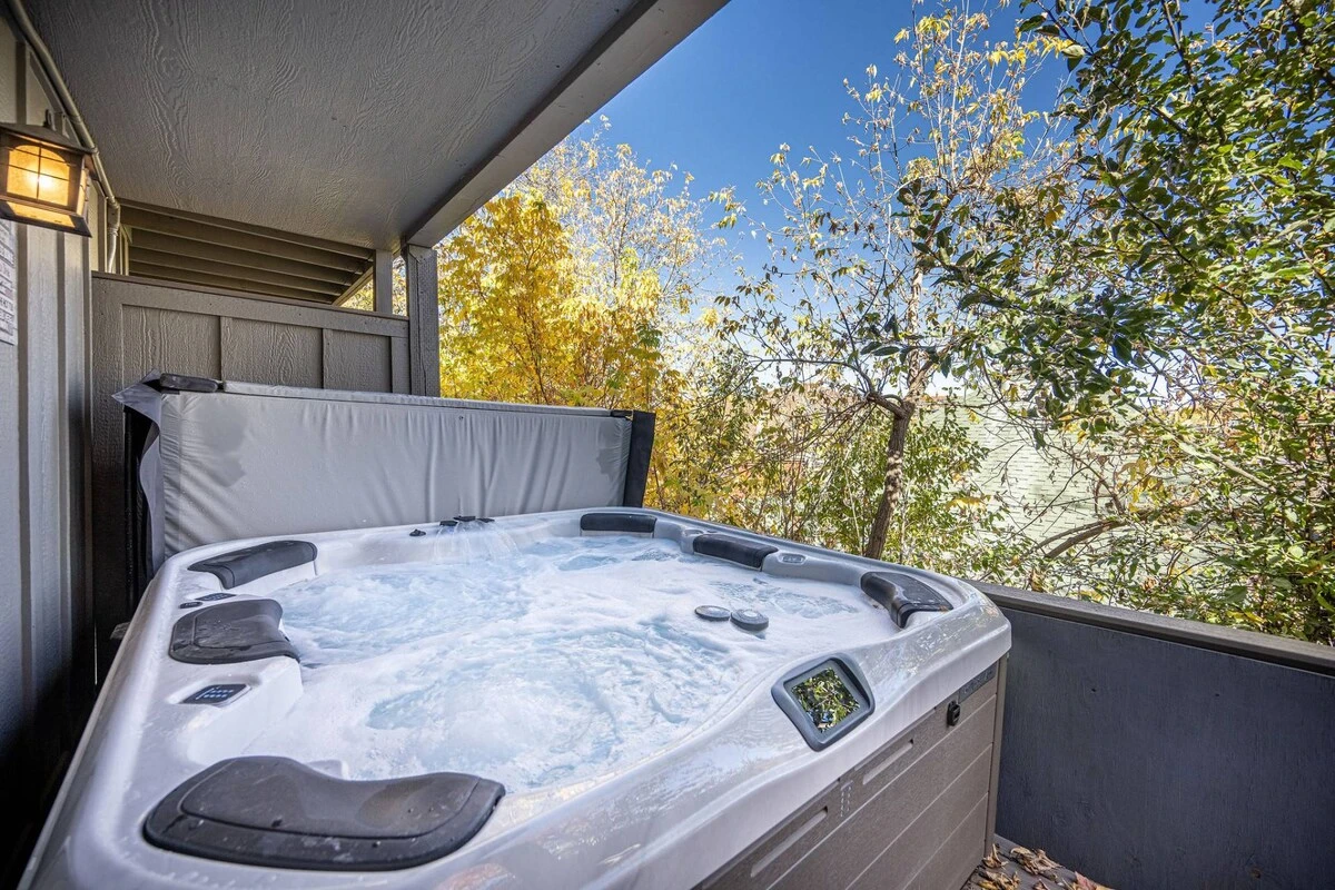 Located on the back deck and nestled into the trees is a brand new private hot tub