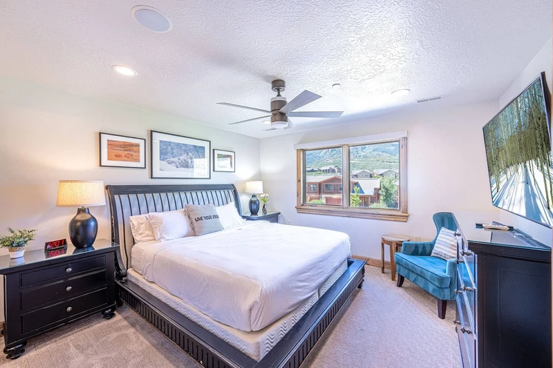 Top floor bedroom featuring comfortable king bed
