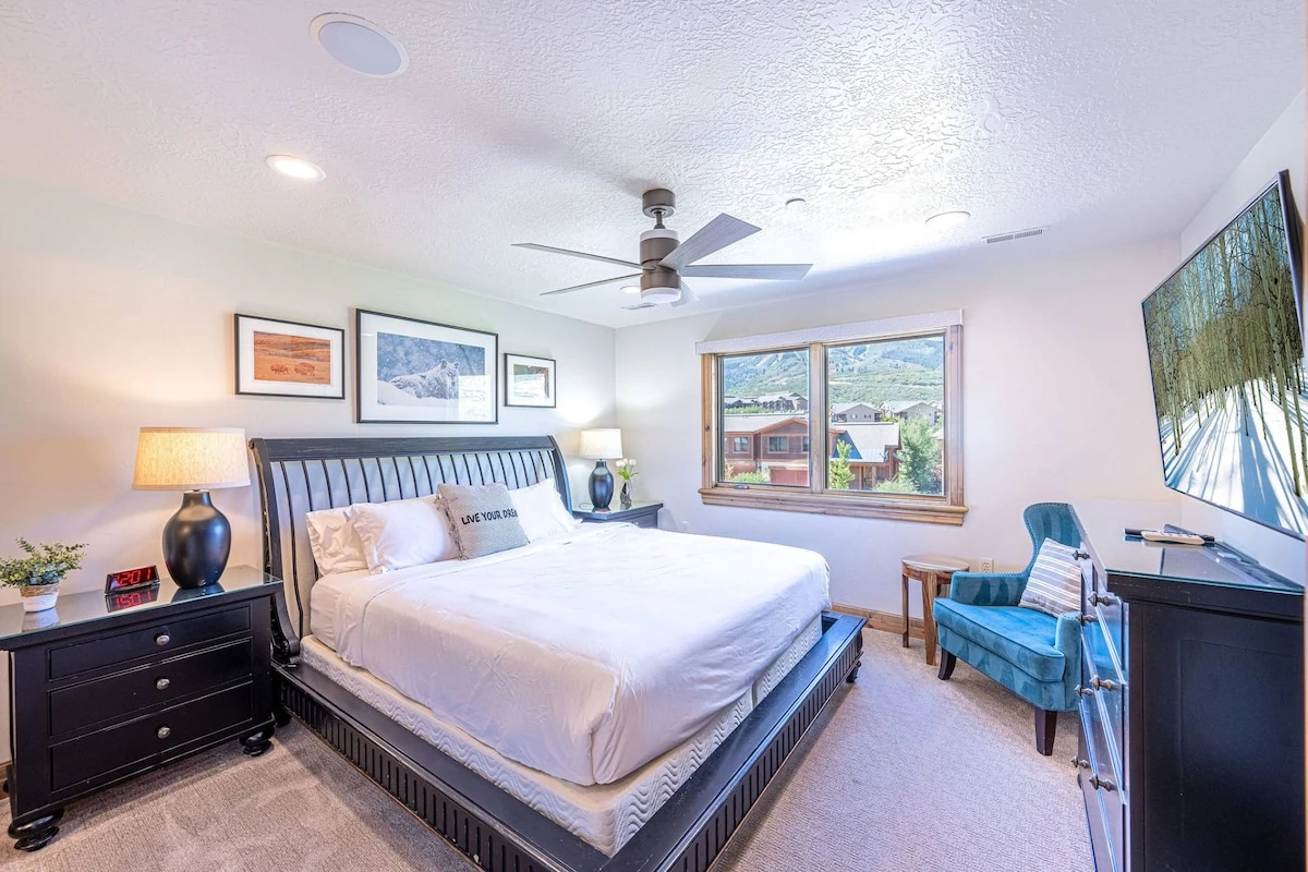 Top floor bedroom featuring comfortable king bed