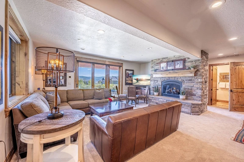 Game Room with plenty of comfortable seating, gas fireplace and HDTV