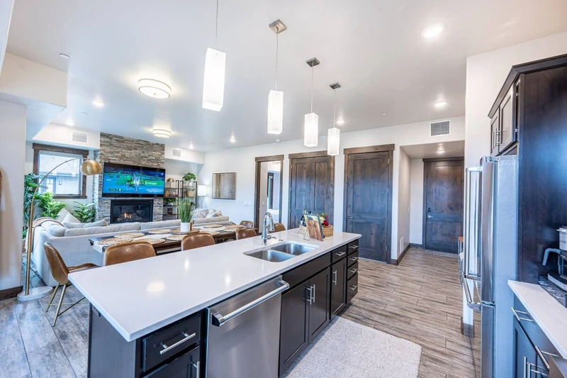 Plenty of space for cooking on this oversized quartz top island with a large dishwasher