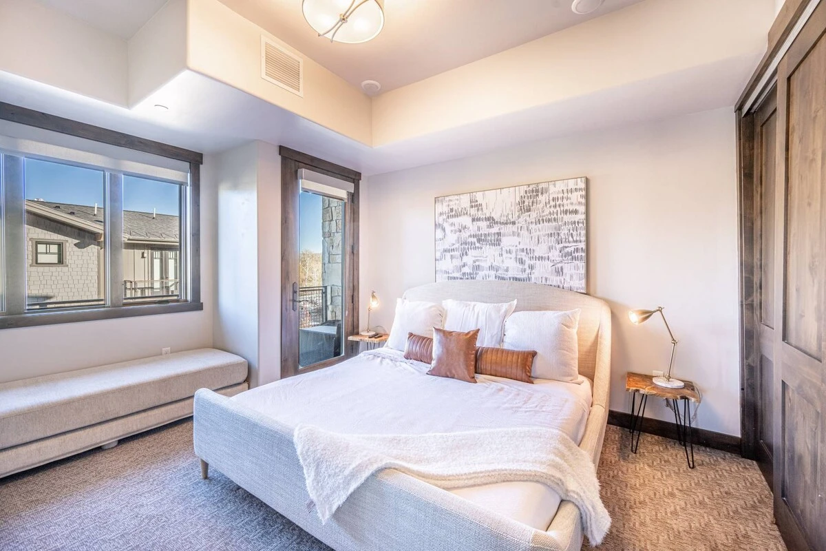 Private bedroom with a new king sized bed and new queen sized daybed, features a private balcony and en suite bathroom