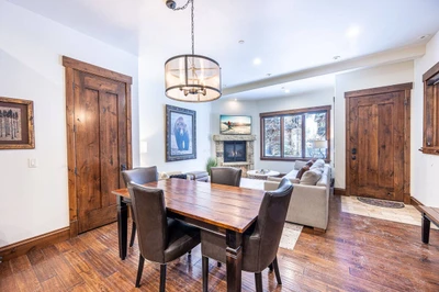 The dining room features a gorgeous wood dining table with luxury seating for 4 guests.