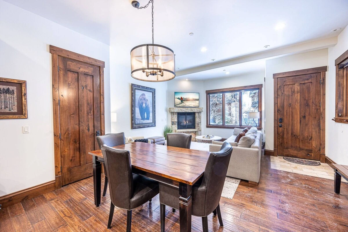 The dining room features a gorgeous wood dining table with luxury seating for 4 guests.
