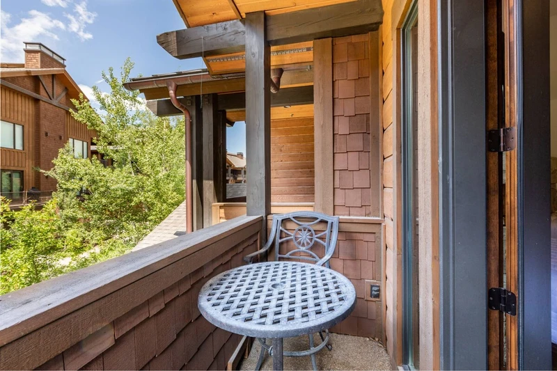 The guest suite also features a private balcony with a table and chairs to enjoy a cup of coffee while watching the sunrise.