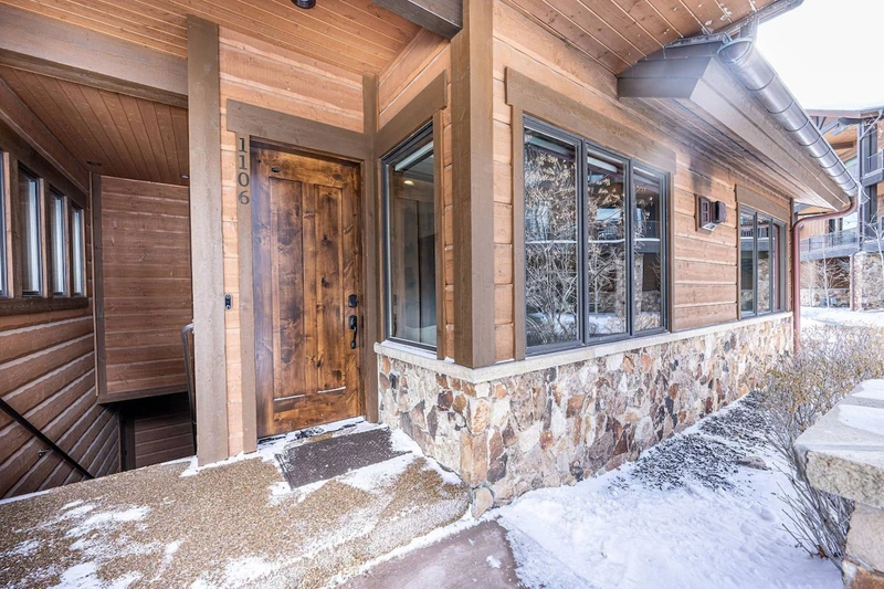 The front door of the home has easy access to the street that leads to the heated pool, fitness center, and more