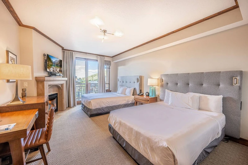 Guest Suite with 2 Queen Beds, Workspace with desk, Fireplace, HDTV