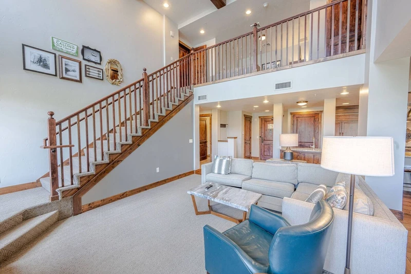 Stairs with solid wooden handles leading to the second floor