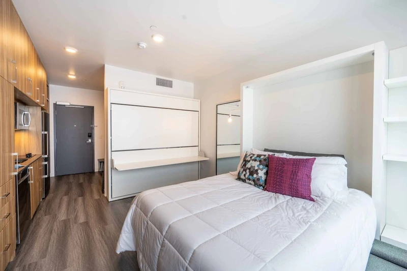 A multi-use shelf (when the twin bunk is away) with your queen bed down