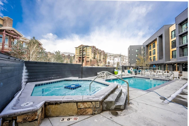 The year around hot tub and heated pool are just steps away from the home.