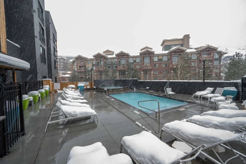 After a long day on the slopes, relax in the heated pool and oversized hot tub that are located just steps from the home.