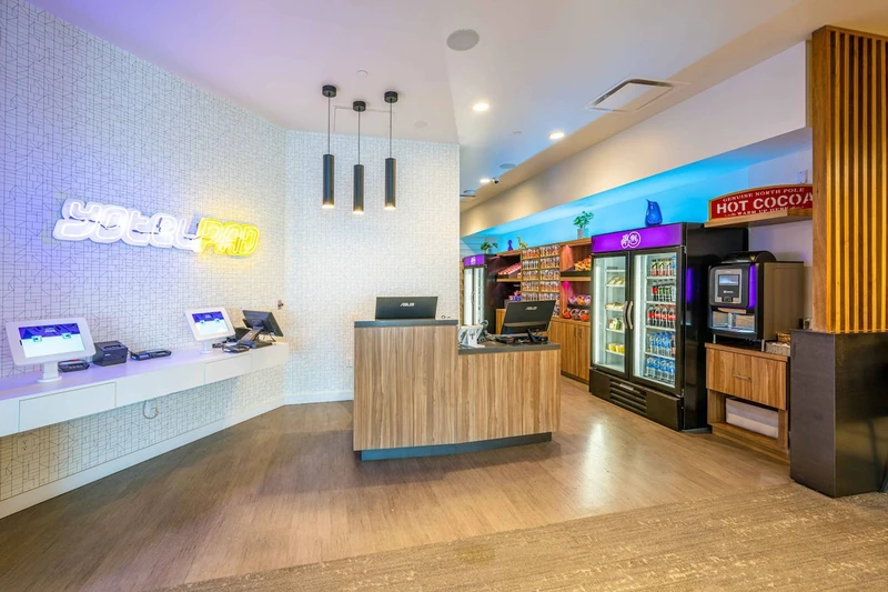 The lobby features a fully staffed front desk and a grab and go store where snacks are available for purchase
