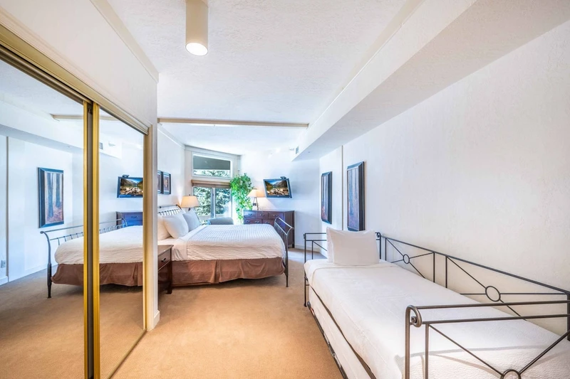Relaxing Primary Suite with king bed, twin bed, and twin trundle.