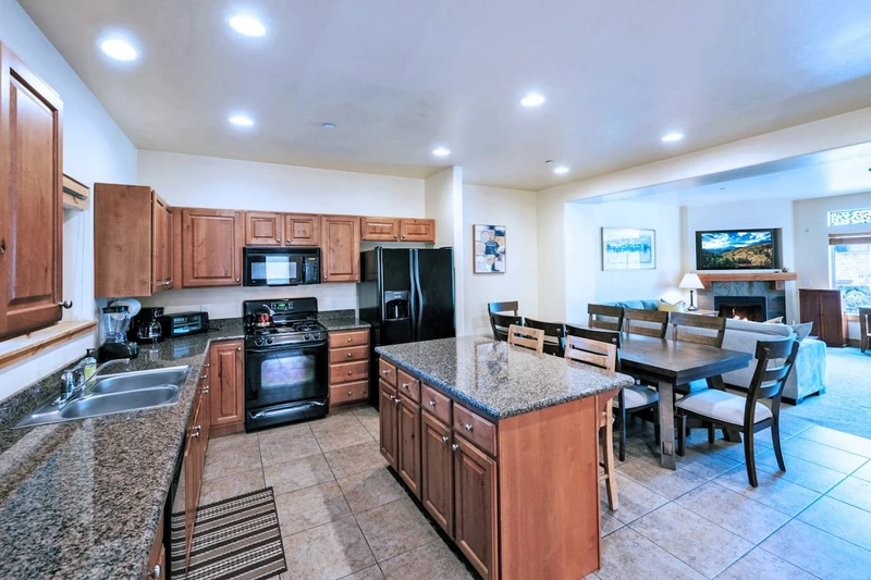 The spacious kitchen has everything needed to make enjoyable meals at home.The island offers a breakfast bar as well as plenty of counter space for se