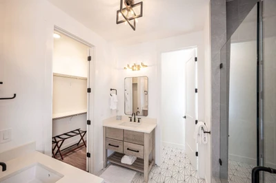 Through the sliding barn door is the exquisite en suite bathroom