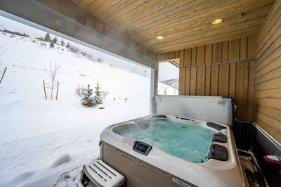Private hot tub backing to Sunrise Run—one of the home’s most private outdoor spaces for quiet evenings, stargazing, and après-ski recovery