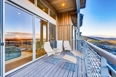 Private deck with panoramic valley views—an additional outdoor space beyond the slopeside patio.