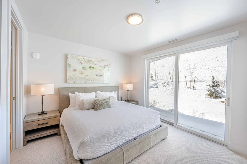 Spacious guest bedroom with private ensuite bath, designed to provide consistent comfort across all five suites.