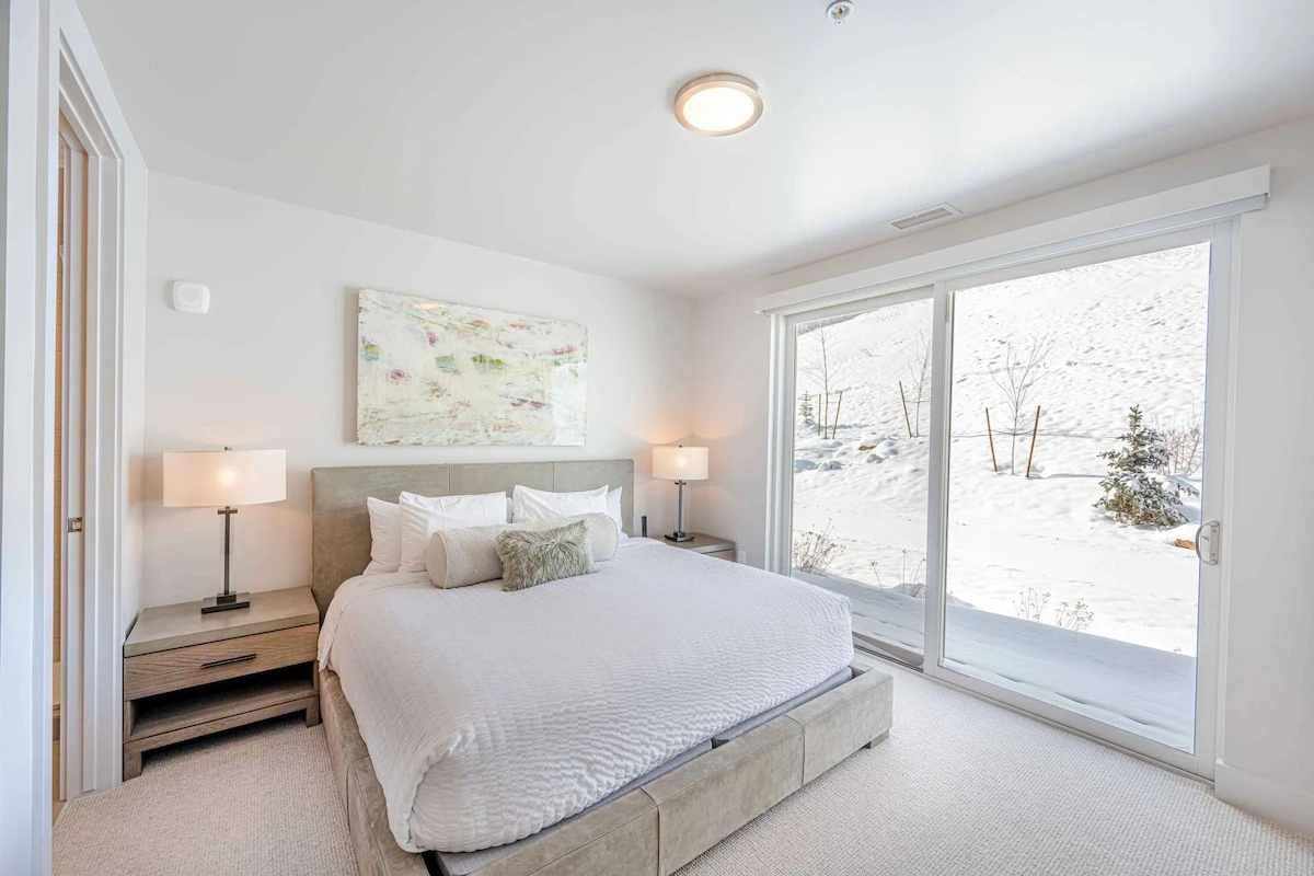Spacious guest bedroom with private ensuite bath, designed to provide consistent comfort across all five suites.