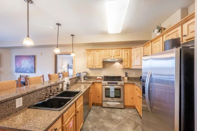 The fully stocked kitchen features full size stainless steel appliances as well as small appliances - including air fryer, keruig, blender, drip coffe