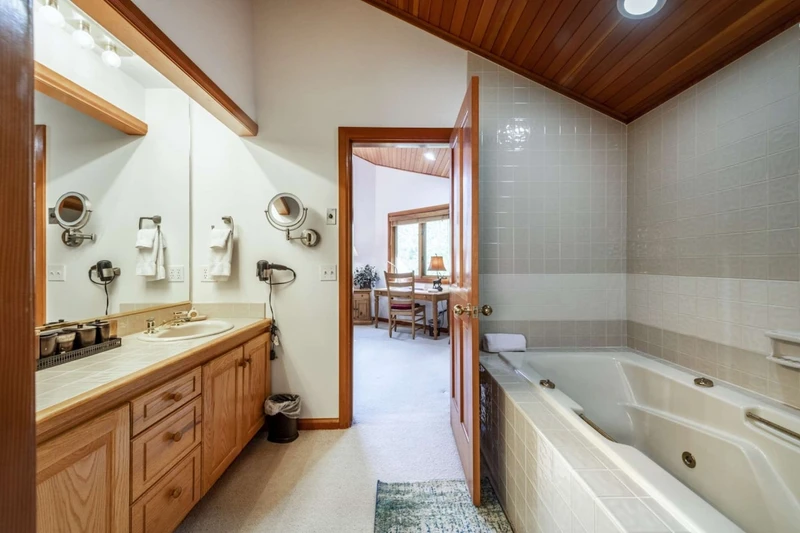 Master Bedroom En Suite Bathroom with Twin Vanities, Oversized Jetted Tub, Separate  Toilet and Glass Shower