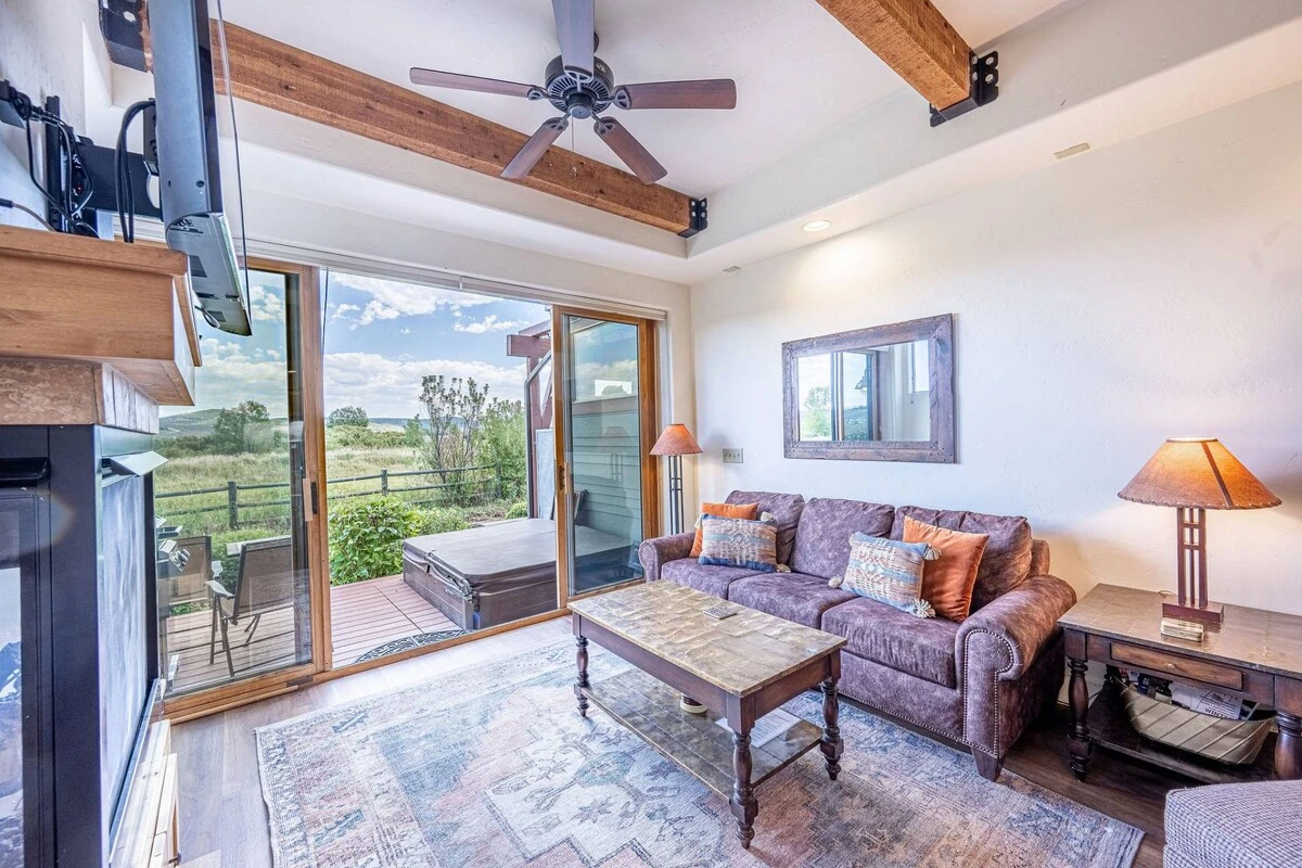 The Warm and Inviting Family Room Features a. Gas Fireplace, Oversized Sofa w Queen Sleeper, 42" HDTV, Sliding Glass Doors to Private Deck, Private Ho
