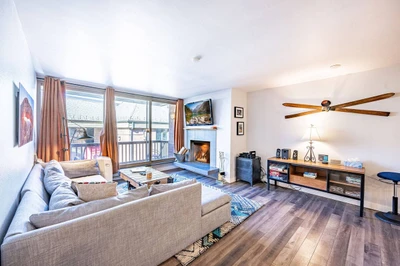 The Inviting Living Room is the perfect place to watch the big game - warm up some snacks and cozy in to watch on the  55" HDTV, Hardwood Floors, High