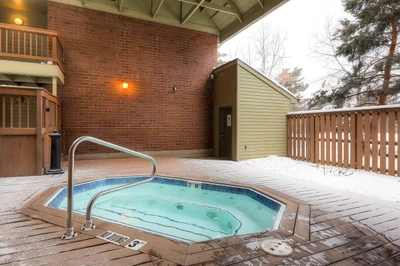 The communal hot tub is outdoors - making it beautiful year round- but it is also conveniently covered.