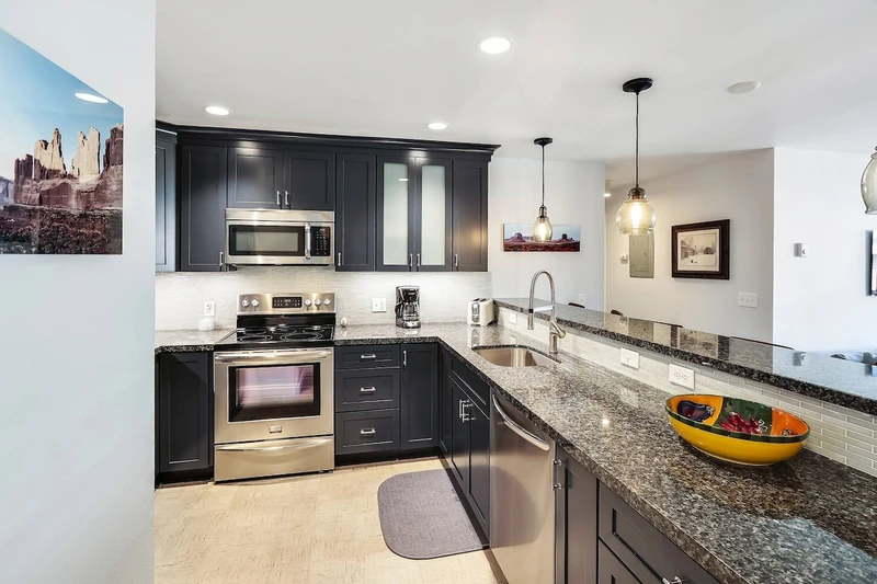 Fully Renovated Kitchen w Granite Countertops, High End Stainless Steel Appliances, All New Wood Cabinetry, Open Floor Plan, Subway Tiling, Wood Floor