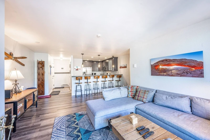 The comfortable sofa and chaise lounge are a great spot to curl up next to the wood burning fireplace and enjoy your favorite movie, binge watch your