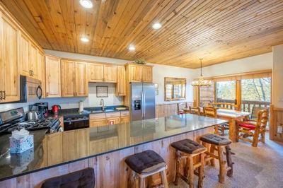 The large breakfast bar has plenty of seating and enough counter space for everyone to dine comfortably. This home is one of the best locations in Par