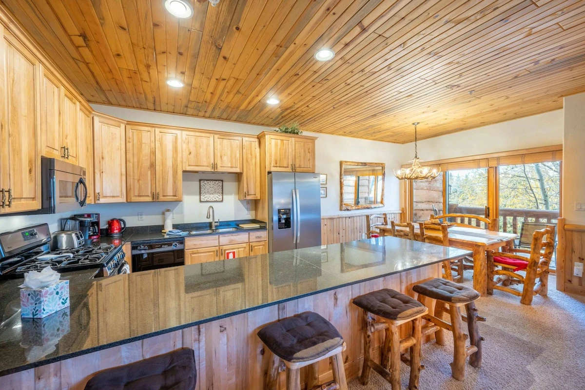The large breakfast bar has plenty of seating and enough counter space for everyone to dine comfortably. This home is one of the best locations in Par