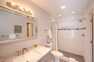Recently Renovated Bright & Spacious Bathroom with New Walk-In, Custom Tile Shower with a Rainfall Shower Head, Granite Counter Top, Beautiful Designe