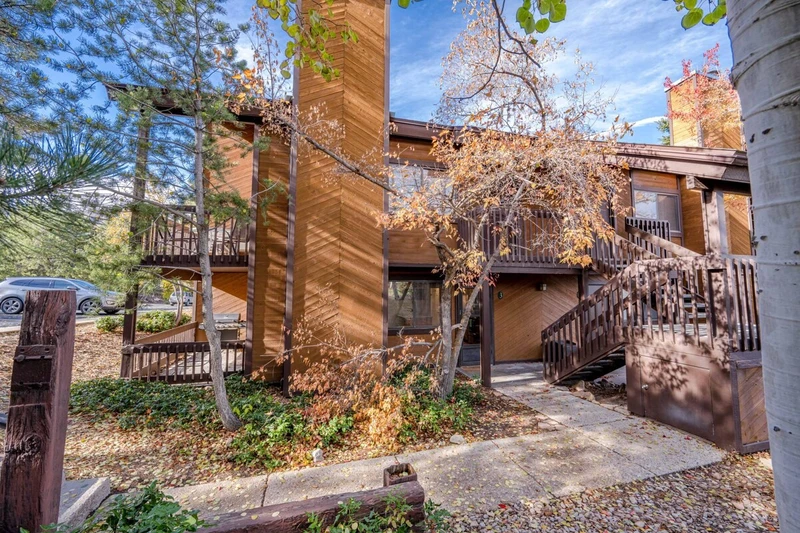 This Classic Park City condo is nestled among the pine trees and aspens
