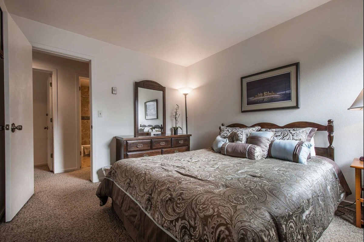 The second bedroom features a queen-size bed with comfortable linens and bedding, closet, large dresser and has lots of natural light.
