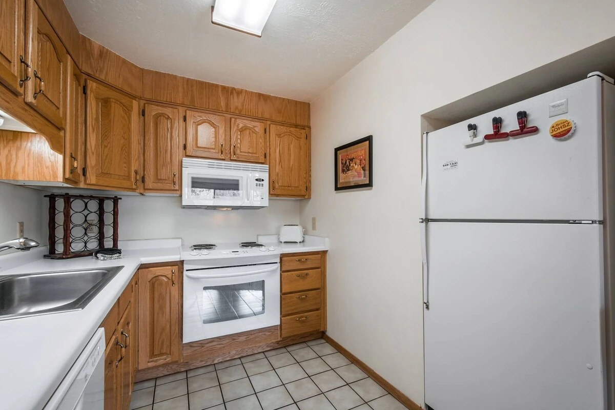 This cozy condominium has all the comforts of home, including a fully-equipped kitchen and open living room.