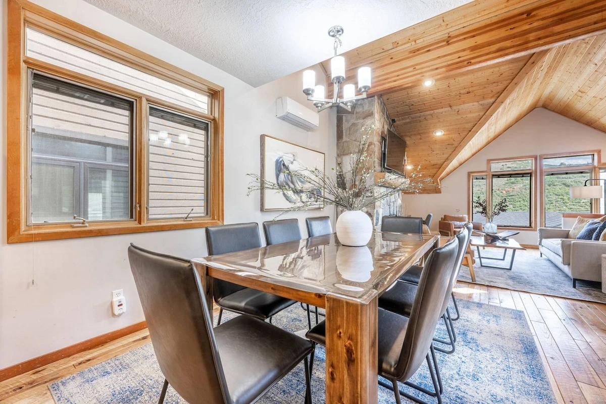 Experience the perfect family meal in our warm and inviting dining room. Adorned with a stunning hardwood table, eight chairs, and a comfortable break