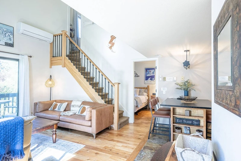 The condo is open concept and the living area is fully furnished with comfortable furnishings, fireplace, hardwood floors and HDTV with satellite TV.