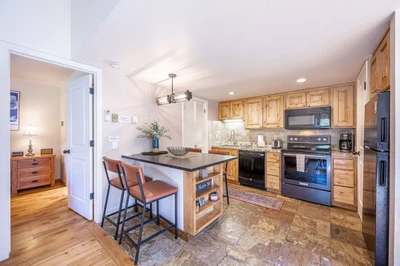 Gorgeously updated 3 bedroom / 2 bathroom home at Red Pine in Canyons. The updated kitchen offers a brand new breakfast bar with 4 comfortable bar sto