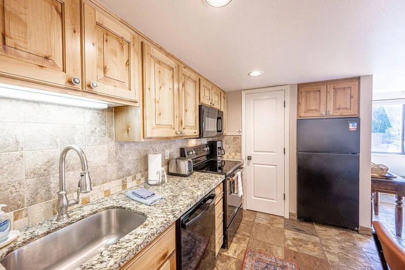 Newly Updated kitchen is also fully equipped with a fridge, dishwasher, stove / oven, microwave and a complete array of other small household applianc
