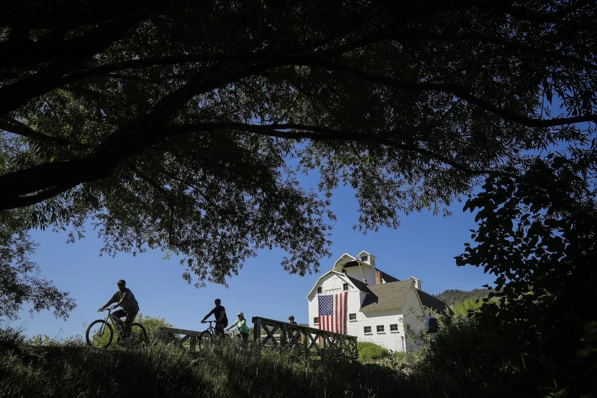 Summer biking near McPolin Barn, with scenic trails and open meadow views just minutes from town.