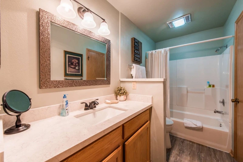 Newly renovated bathroom in December of 2017 complete with wood floors and marble countertops!