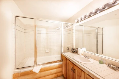 Spacious en Suite Bathroom with Oversized Jetted Tub, Tiled Glass Shower, Large Tiled Vanity