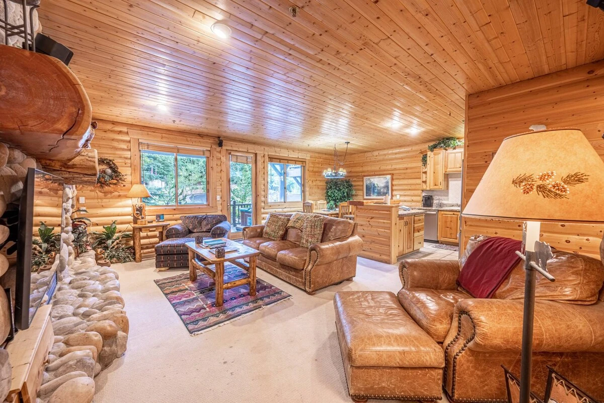 The Open Floor Plan Has a Dining & Living Area Which Flow Seamlessly, The Living Area Has a Leather Queen Sleeper Sofa, Stone Encased Gas fireplace, H