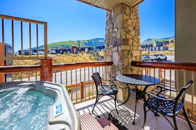 This home has 2 patios, this is the smaller of the two with a private hot tub and dining area
