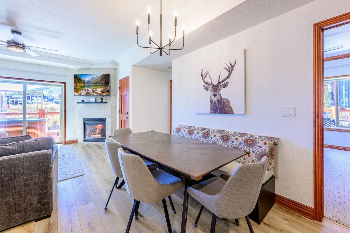 Open floor plan with wood flooring, dining room, living room and kitchen flowing together. Great for families