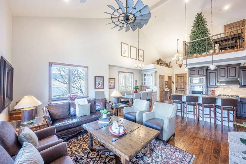 The open floor plan is perfect for gathering - this is the living room, which is located on the main floor. It features comfortable furniture, gas fir