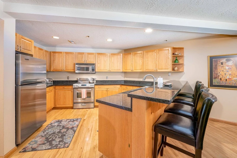 This extra large gourmet kitchen is newly renovated all new appliances, granite counters, and a breakfast bar with seating for 4 guests.